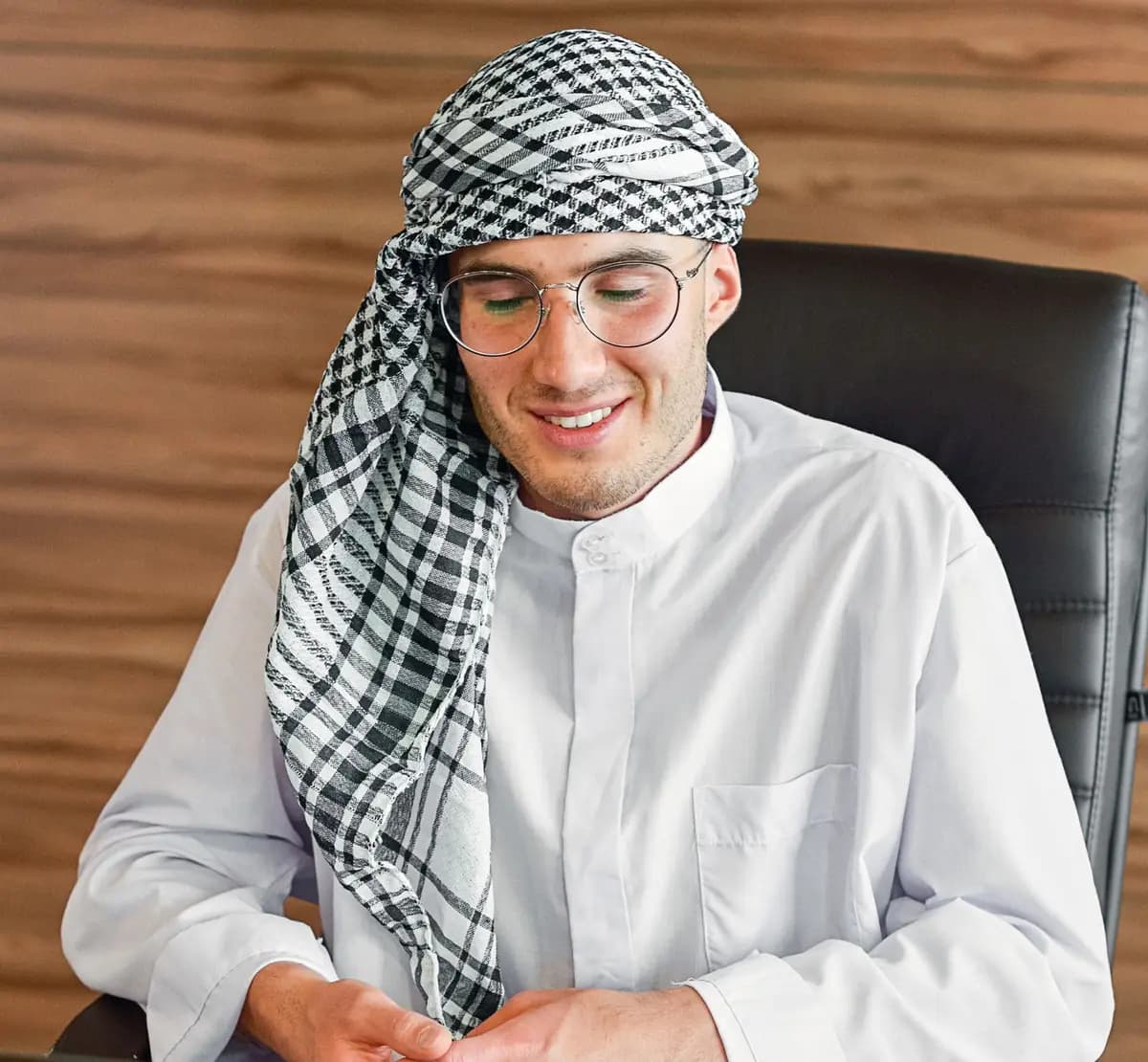 Business owner at his desk after receiving his UAE trade license